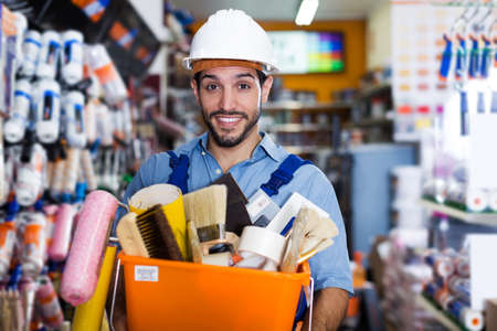 foreman holding basket with toolsの写真素材