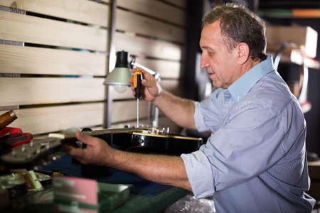 Music master is repairing music instrumentsの写真素材