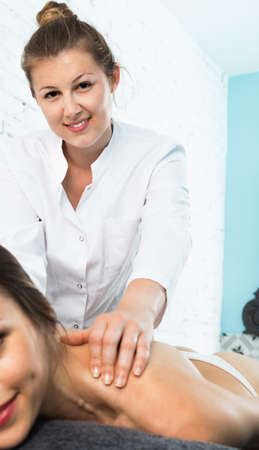 Relaxing professional massage for young womanの写真素材