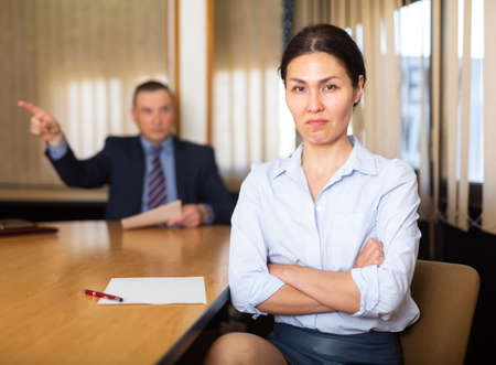 Businessman boss firing upset asian femaleの写真素材