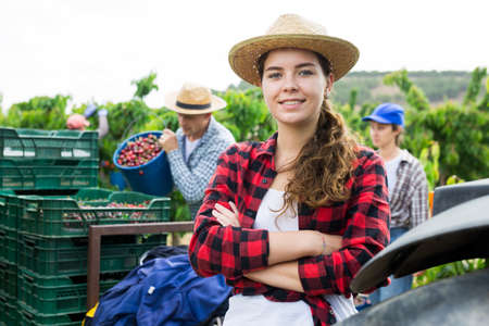 Portrait of a positive young girl farmerの写真素材
