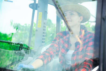 Portrait of young female farmer working on fieldの写真素材