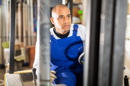 Forklift driver driving at hardware store