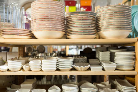 Various plates for sale in tableware department of storeの写真素材