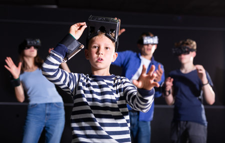Portrait of a boy who took off his virtual reality glasses