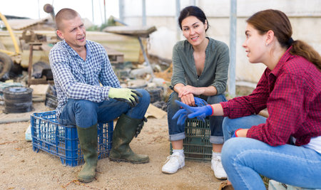 Three workers talking