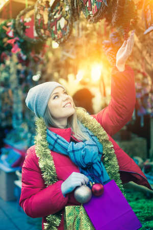 Young female teen customer with Christmas giftsの写真素材