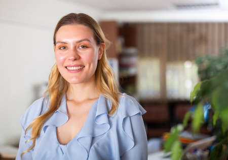 Business woman posing in her officeの写真素材