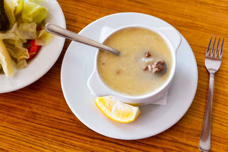 Turkish soup Paca corbasi served with pickle vegetablesの写真素材