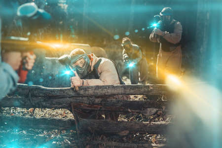 Paintball team aiming outdoorsの写真素材