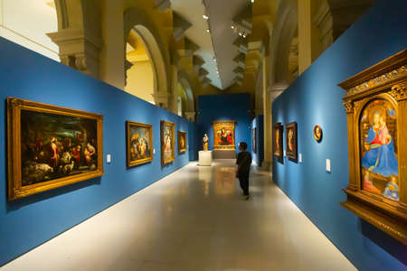 Visitors of national museum of Catalan visual art viewing paintingsのeditorial素材