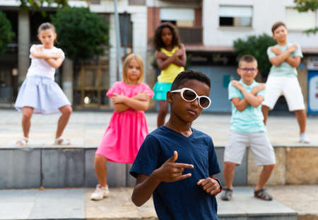 Group of kids performing street dance outdoorsの写真素材