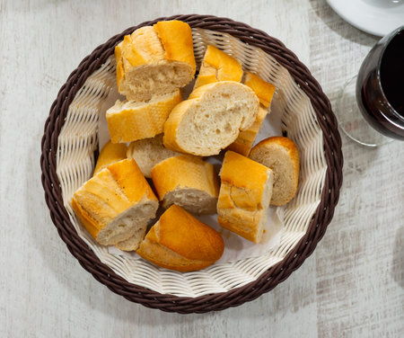 Sliced french baguette on plate in restaurant