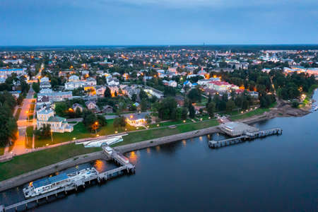 Flight over evening city of Uglich and Epiphany Cathedral on banks of Volga Riverの写真素材