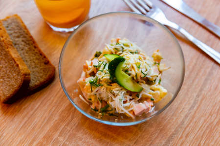 Fresh Russian salad cooked and served on tableの写真素材