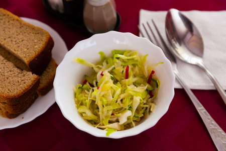 Appetizing salad of Russian cuisine, made from fresh cabbage with cucumberの写真素材