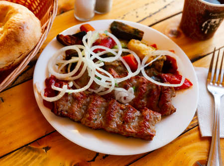 Grilled lula kebab - meat dish, with vegetable and onion. Popular oriental dish closeupの写真素材