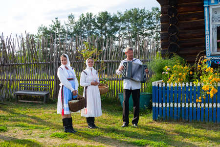 Folklore group of Ethnographic Museum showing performance outdoors in summer, Kozmodemyanskのeditorial素材