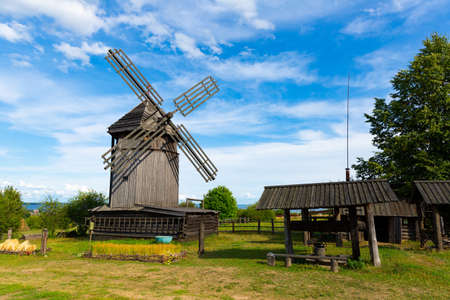 Wooden windmill and timber constructions in Ethnographic Open-Air Museumのeditorial素材