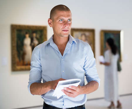 Portrait of man in galleryの写真素材