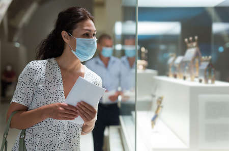 woman admiring art work in museumの写真素材