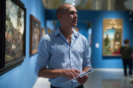 man admiring art work in museumの写真素材