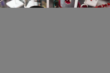 Various designs of imitation jewellery on showcase in shopの写真素材