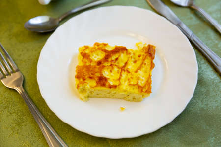 Portion of omelette on plate at eateryの写真素材