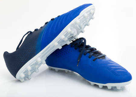 Traditional leather soccer boots isolated on white backgroundの写真素材