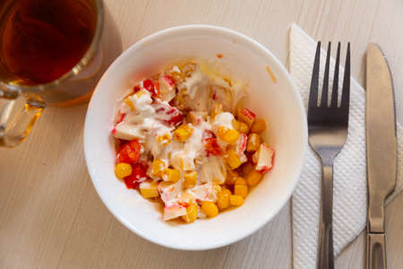 Salad of crab sticks, cheese and corn white teaの写真素材