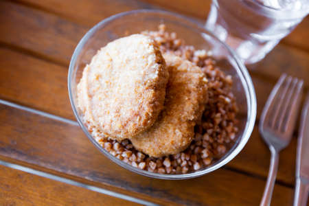 Appetizing buckwheat porridge with cutlet on plate. Healthy food. Russian cuisineの写真素材