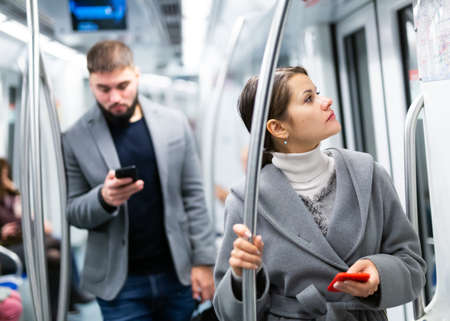 Young woman traveling in subway carの写真素材
