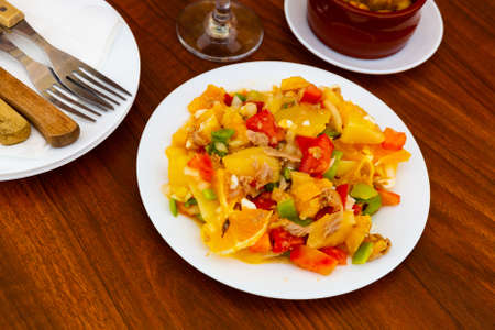 Andalusian salad with fish and vegetables for dinnerの写真素材