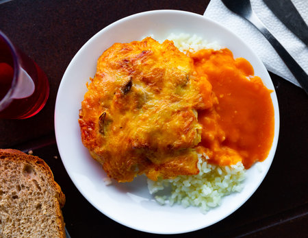 Baked chicken fillet with mushrooms and rice. Russian cuisine