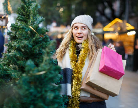 Woman buying Christmas treeの写真素材