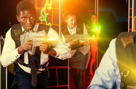 Afro businessman playing laser tagの写真素材