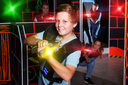 Teen boy playing laser tagの写真素材
