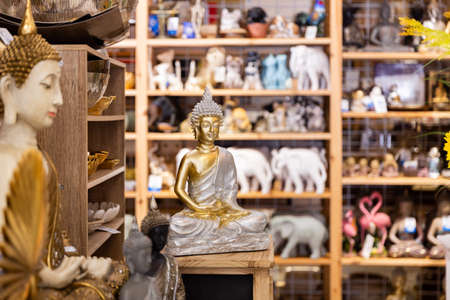 Various Indian figurines on shelves of gift shopの写真素材