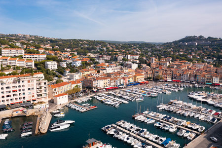 Aerial view of Cassis cityscape on Mediterranean coast with marina
