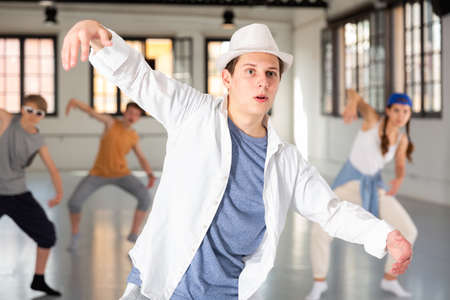 Group teenagers dancing hip-hop indoorsの写真素材