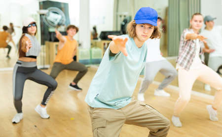 Teenagers dancing hip-hop in studioの写真素材