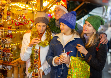 Parents and kids choosing christmas decorationsの写真素材