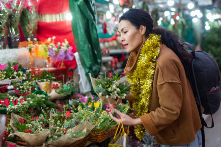 Asian woman at christmas fairの写真素材