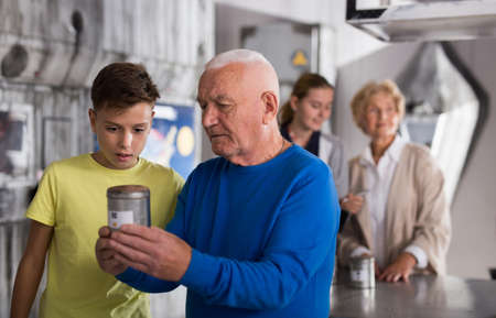 Grandson together with his grandfather solve the riddles of quest roomの写真素材
