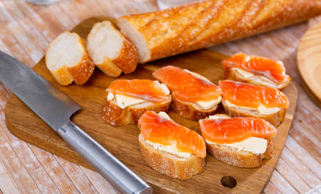 Appetizer canape of baguette with smoked salmonの写真素材