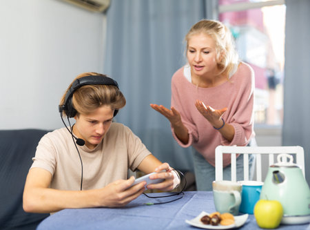 Mother asking for attention of her teenager son