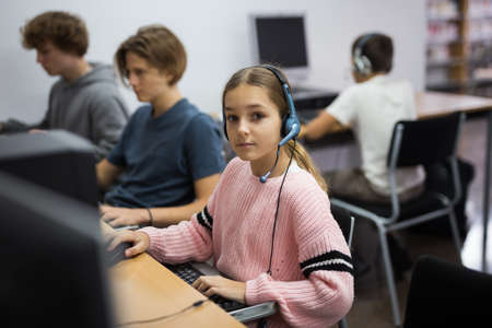 Young girl in computer classの写真素材