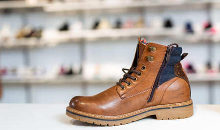 Lots of leather wintry male and female shoes at store