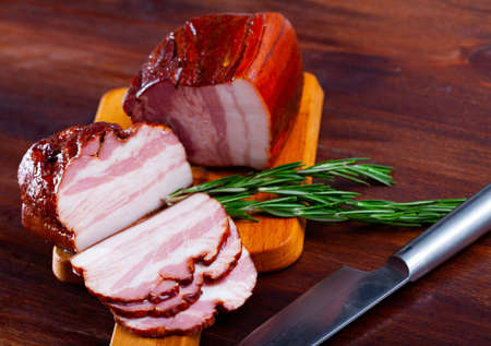 Appetizing smoked pork belly on the tableの写真素材