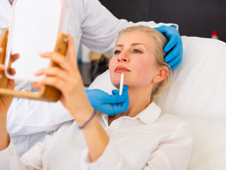 Young woman on doctor-cosmetologists appointment